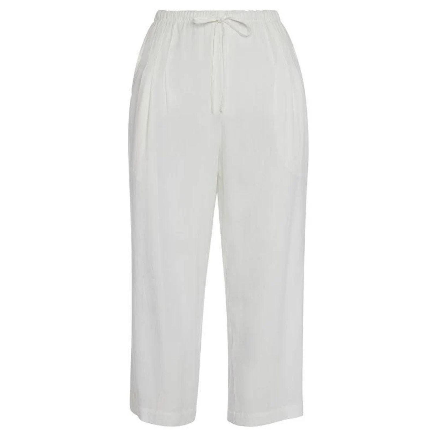 This is a product photo of a pair of plain white cropped pants shown flat against a white background. They have a relaxed fit, an elastic waistband, and a visible drawstring tie.