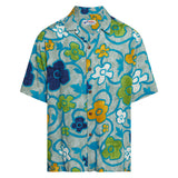 A short-sleeved, collared aloha shirt with a vibrant teal-blue background and a bold, stylized floral pattern in yellow, green, dark blue, and white is displayed flat against a white background.