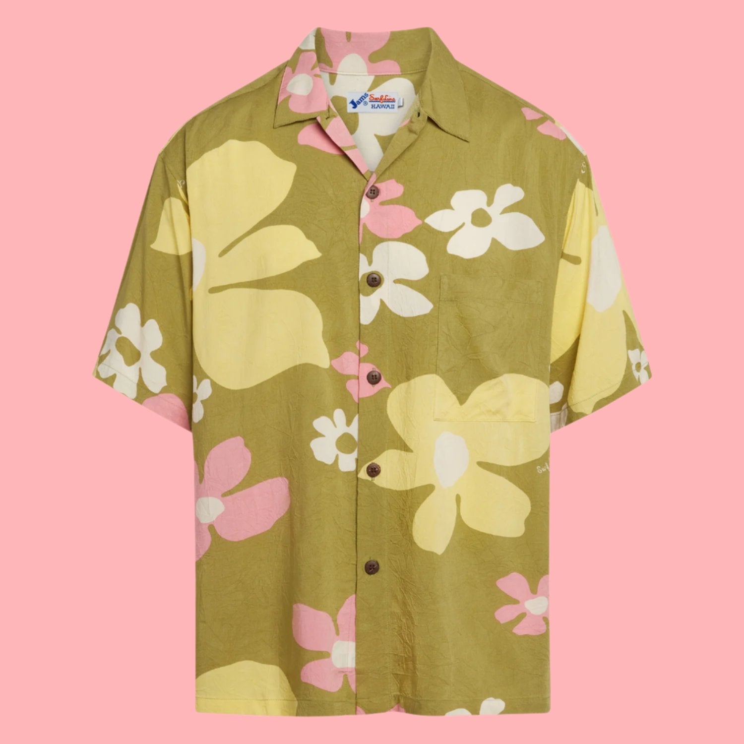 This is a product shot of a short-sleeve button-up shirt laid flat against a solid bright pink background. The shirt features a large-scale, stylized floral print on a crinkled, olive green fabric. The flowers are large and abstract, colored in pale yellow and soft pink, with small white accents. The shirt has a camp collar and is fastened with small, dark brown buttons.