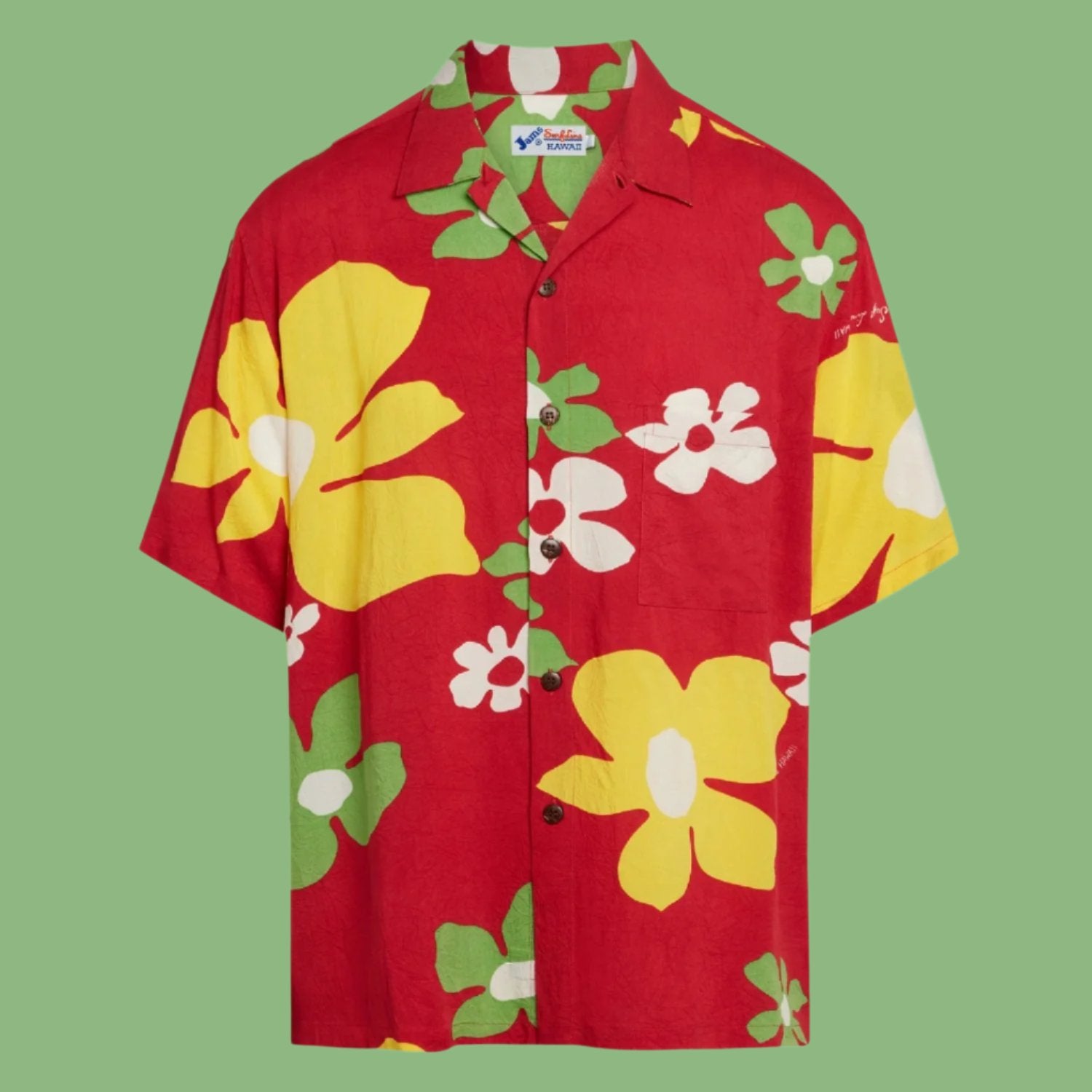 Product shot of short-sleeve button-up laid flat against a solid green background. The shirt has a dominant bright red background covered in a large, abstract floral print featuring big yellow flowers, white flowers, and light green leaves. The shirt has a camp collar, a single chest pocket, and is fastened with small, dark brown buttons.