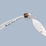 Three Surfboard shaped key chain  with white wristlets.
