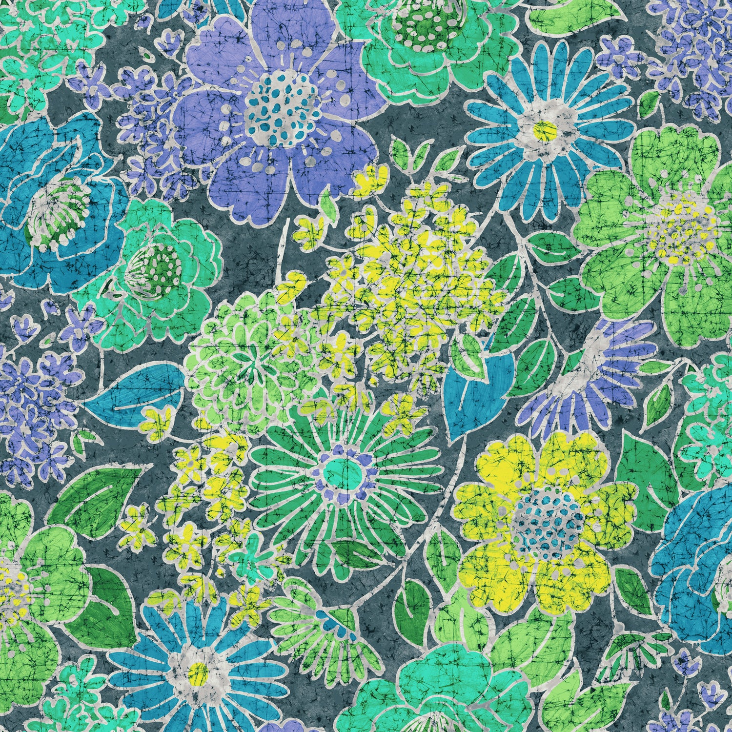 A close-up view of the fabric pattern. It is a dense, batik-style print of various large and small stylized flowers and leaves on a dark blue-gray background. The colors include lime green, turquoise, lavender purple, and bright yellow, with thin white lines outlining the elements. The entire pattern has a characteristic fine, crackled texture, typical of batik.