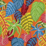 Close-up of the textile print, showcasing a dense, layered pattern of stylized tropical leaves. The leaves are painted with visible texture and thick brushstrokes in bold, highly contrasting colors: royal blue, yellow, red, lime green. All the leaves overlap against a solid bright orange background.