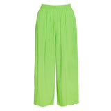 This image shows a pair of loose-fitting, lime green wide-leg pants with an elasticated waistband, displayed flat on a white background.