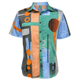 This is a flat studio shot of the men's collared shirt set against a white background, clearly displaying its unique print. The shirt features an abstract design of large blocks and lines of color, with prominent orange circles and linear details across the surface.