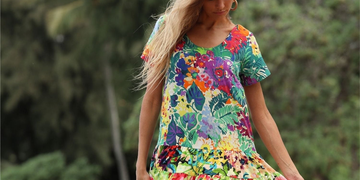 Colorful Floral Fiore White Hattie Dress on model standing on beach
