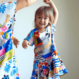 Colorful girls dress florals and graphics on a white background