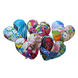 Colorful heart-shaped balloons with various patterns on a white background