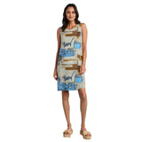 Woman wearing a sleeveless dress with abstract pattern on a white background