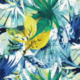 A close-up of a vibrant, abstract fabric pattern composed of overlapping tropical leaves. The print uses a watercolor style with colors primarily in bright, saturated blue, various greens, and sunny yellow, creating a dense, jungle-like effect.