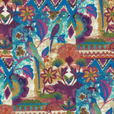 A vibrant close-up of a fabric featuring a bohemian patchwork-style print with birds, flowers, and geometric patterns in teal, magenta, and gold.