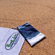Towel with a logo on sand
