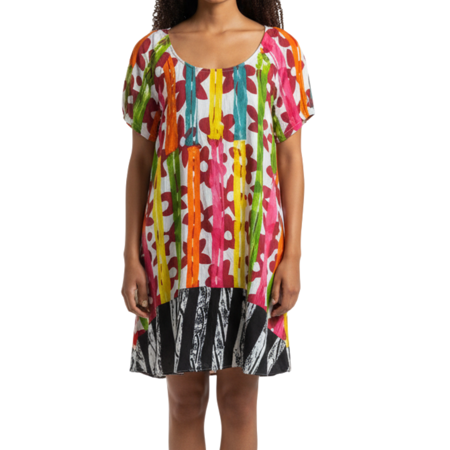 Woman wearing a colorful patterned dress on a white background