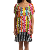 Woman wearing a colorful patterned dress on a white background