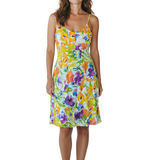 Woman wearing a colorful floral dress on a white background