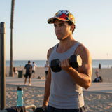 Man exercising with dumbbells on a beach at sunset