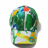 Colorful cap with a tropical leaf pattern on a white background