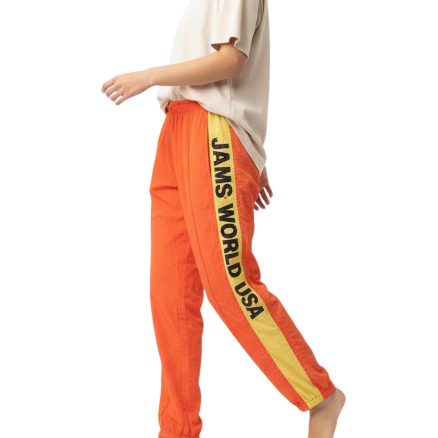 Orange sweatpants with 'JAMS WORLD USA' stripe on a white background