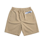 Beige shorts with a pocket and 'JAM'S' logo on a white background