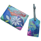 Floral and leaf patterned cardholder and luggage tag on a white background
