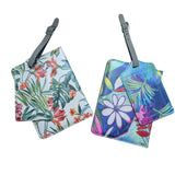 Two floral-patterned luggage tags on a white background