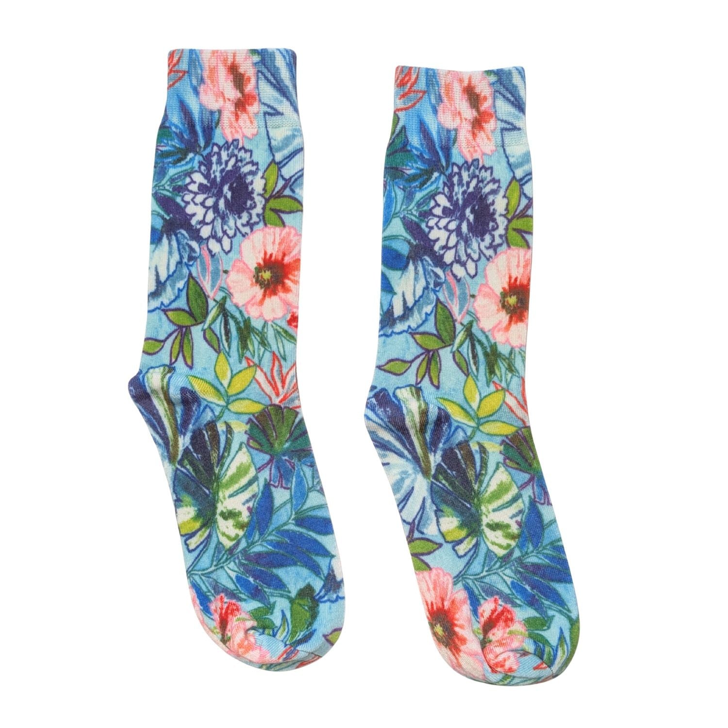 A pair of crew socks with a vibrant tropical floral and leaf print on a light blue background, featuring pink, purple, and green botanical motifs.