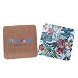 Two square coasters on a white background. The left coaster is natural cork with colorful 'HAWAII' lettering and 'HONOLULU' underneath.
