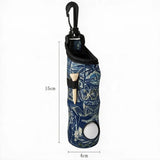 A golf accessory bag with a blue and white tropical pattern, featuring a black carabiner clip, a wooden tee, and a white golf ball. The image includes dimension lines indicating a height of 15cm and a width of 4cm.