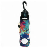 A slim, insulated bottle carrier sleeve with a black carabiner clip at the top and a colorful tropical floral print. A small white bottle is partially inserted into the side pocket, shown against a plain white background.