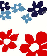 A seamless textile pattern featuring large, stylized, five-petal flowers scattered across a white background. The flowers are in three colors: bright red, dark navy blue, and a medium sky blue. A small “Surf Line HAWAII” logo is subtly printed in the center of one of the navy blue flowers.