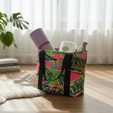 Colorful bag with a yoga mat, books, and a bottle on a wooden floor.