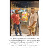 San Jose Del Cabo Art Walk  Artist Juan and Jams World president Pua Rochlen  admire Juans color piece of art on canvas