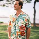 Man wearing a colorful floral shirt outdoors
