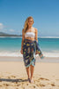 Model on beach wearing No ka 'oi pareao and white bando